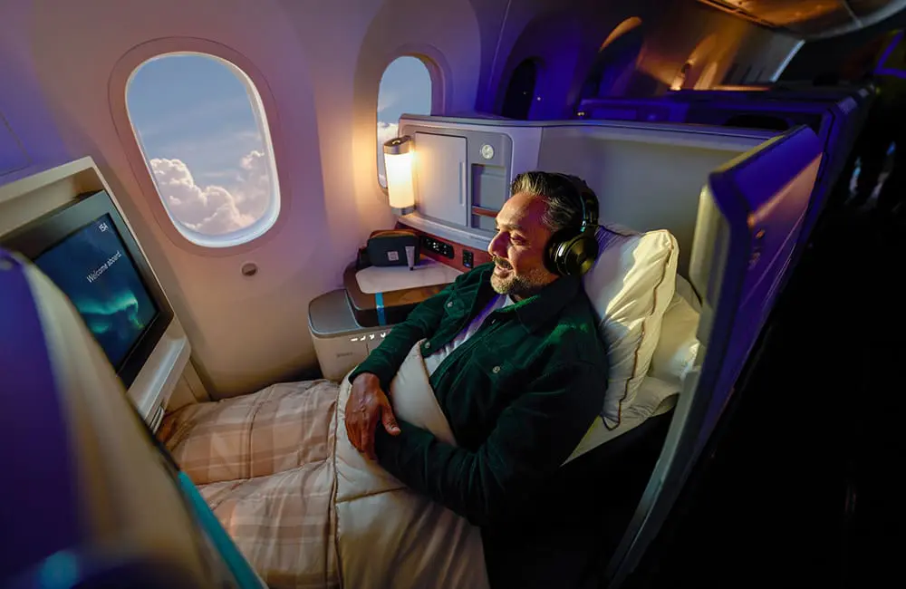 Alaska Airlines unveils first-ever International Business Class Suites for Europe & Asia flights 3 Male passenger in Alaska Airlines International Business Class Suites