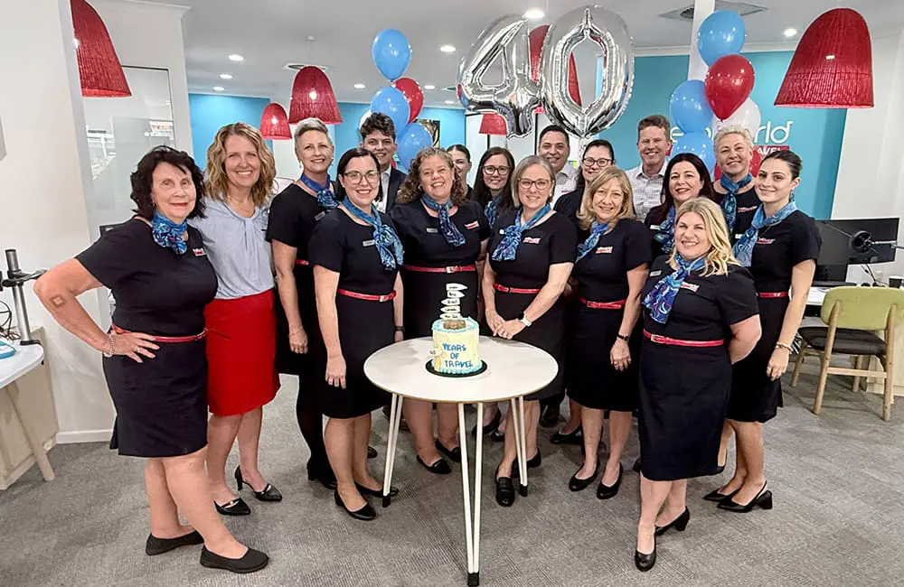 Helloworld Travel Mackay & Mt Pleasant agency owners Annabel and Ben Dolphin with the Helloworld Travel Mackay team.