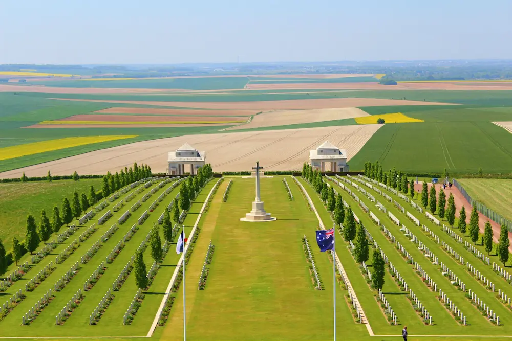 Anzac Day: DFAT issues new travel warning for Gallipoli and France services 2 memorial of the first world war at villers-bretonneux in somm, under sun and blue sky