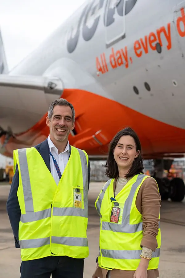 Jetstar Head of Network & Fleet Strategy Ted Knight and 787 Cabin Refresh Program Manager Sophie Dawson on Melbourne Airport tarmac in front of JQ Dreamliner.