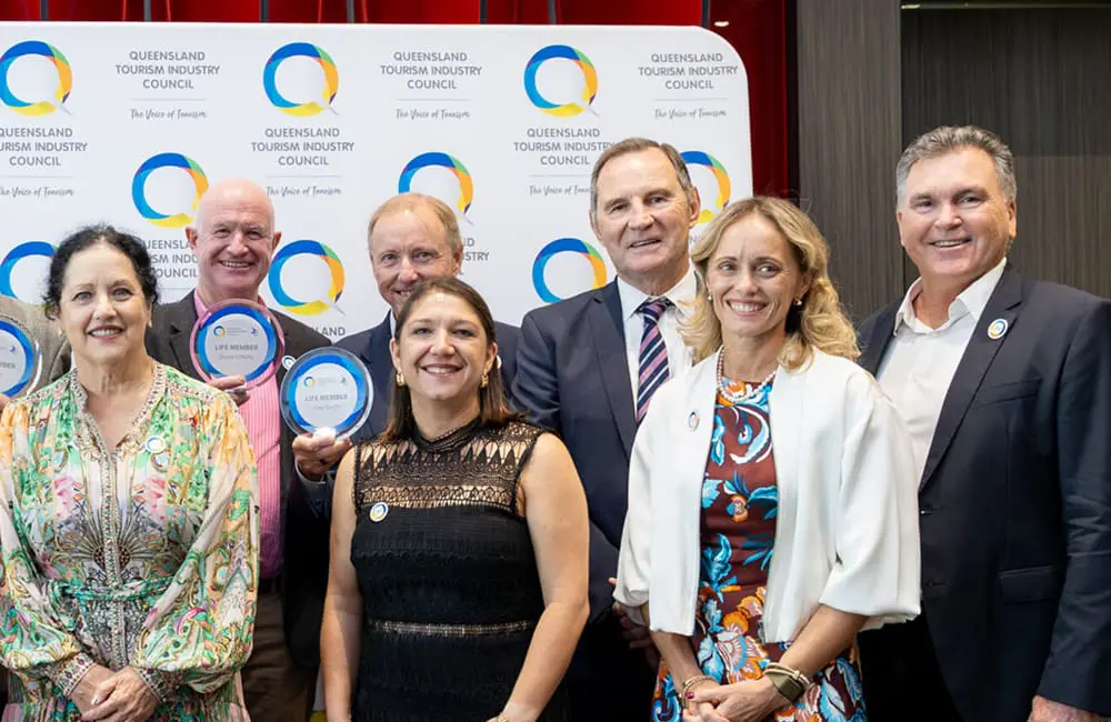 QTIC CEO Natassia Wheeler (front, centre) and TEQ CEO Craig Davidson (front, right) at the recent QTIC 25th anniversary event in April 2026.