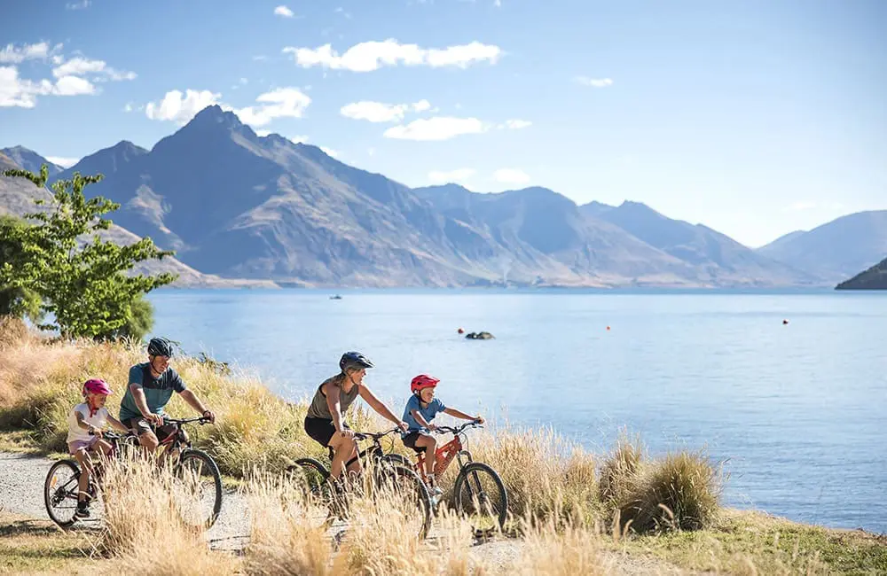 Family biking at Queenstown Gardens in New Zealand – ANZCRO New Zealand Family Holidays