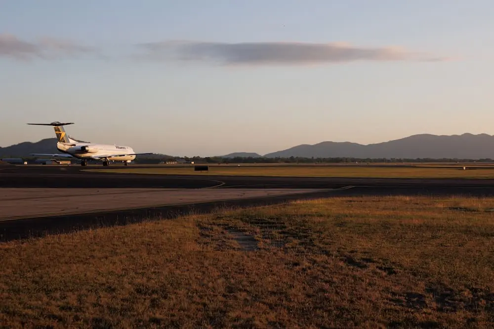 Queensland airports see record travel as Cairns launches major retail tender 1 Townsville, Australia - 10 August 2022: Alliance Airlines Fokker 100 flight taxiing at Townsville airport in north Queensland, Australia
Airports