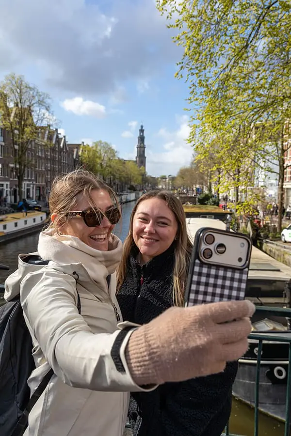 Avalon advisor charter 2026 duo take selfie in Amsterdam canal