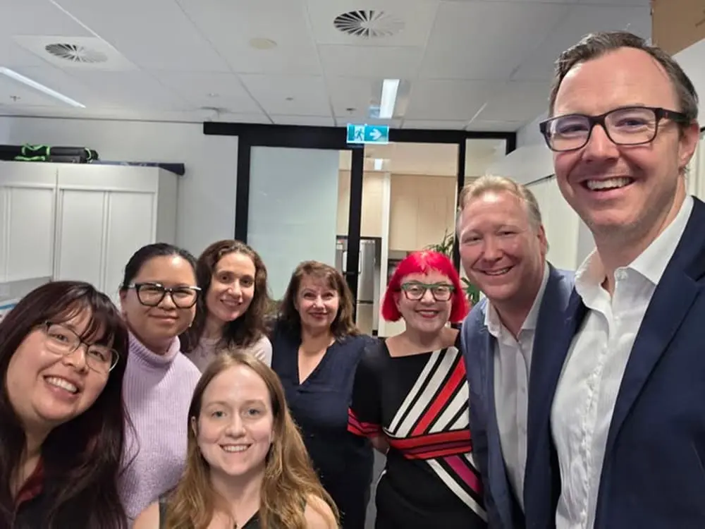 "Part of the fabric": ATIA's Gina Dounis celebrates 30 years supporting Aussie travel businesses 1 Celebrating a milestone at ATIA (L-R): Elaine Trinh, Jessica Best, Jenny Le, Daria Donjerkovic, Gina Dounis, LJ Loch, Christian Hunter & Dean Long.