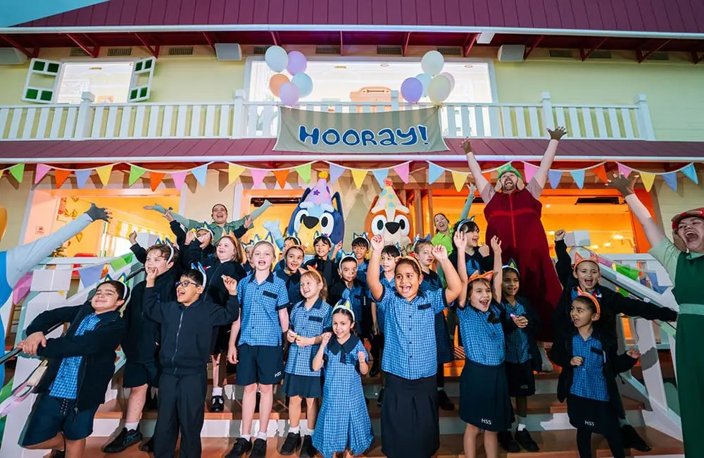 Brisbane schoolkids celebrate news of an extended Bluey's World run.