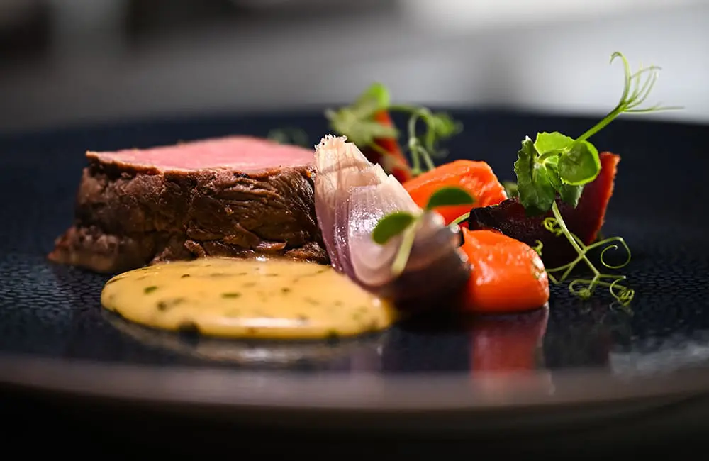 Savour chef-led interpretations of Greenlandic cuisine like South Greenland lamb shoulder with turnips with HX Greenland expeditions.