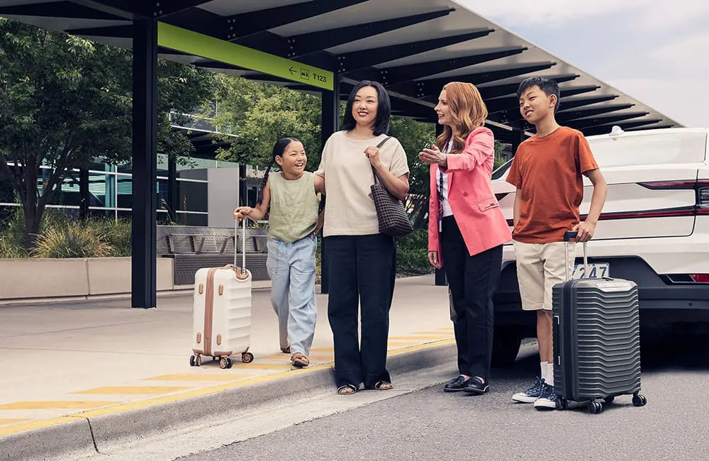 Family with Melbourne Airport Ambassador at drop-off location with car. Image: Melbourne Airport