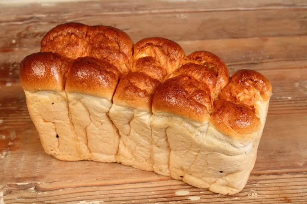 Mosbolletjies a traditional South African bread made from pastry dough with grape mushrooms and flavored with anise in landscape format on a clear background with copy space