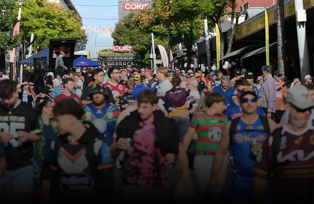 NRL launches fan travel program with packages for Grand Final and World Cup 2 Crowd of different rugby league team fans on Caxton Street in Brisbane for NRL Travel
