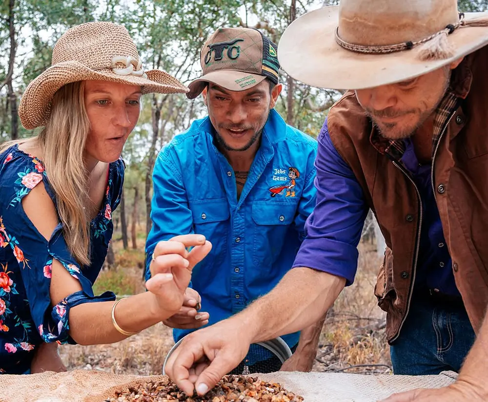 Gems Tag A Long Tours' Jeb Connelly (centre) was crowned Queensland's Top Tour Guide for 2026.