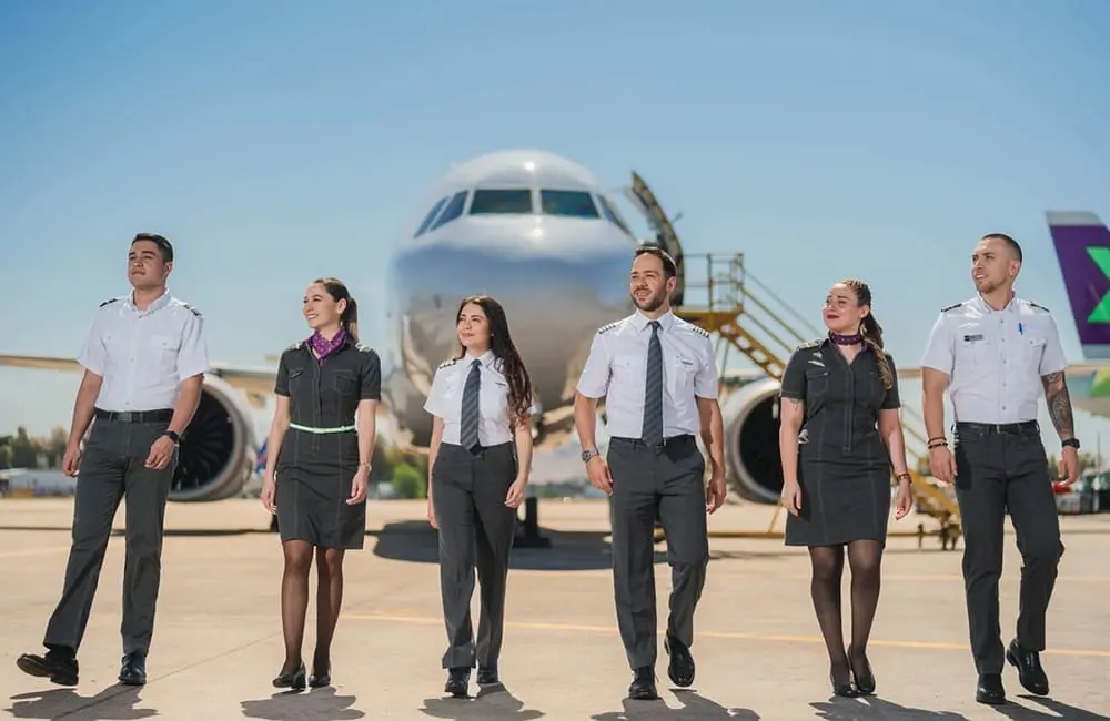 Qantas links Aussies to 20+ South American destinations via new airline deal 2 SKY Airline crew on tarmac in front of plane