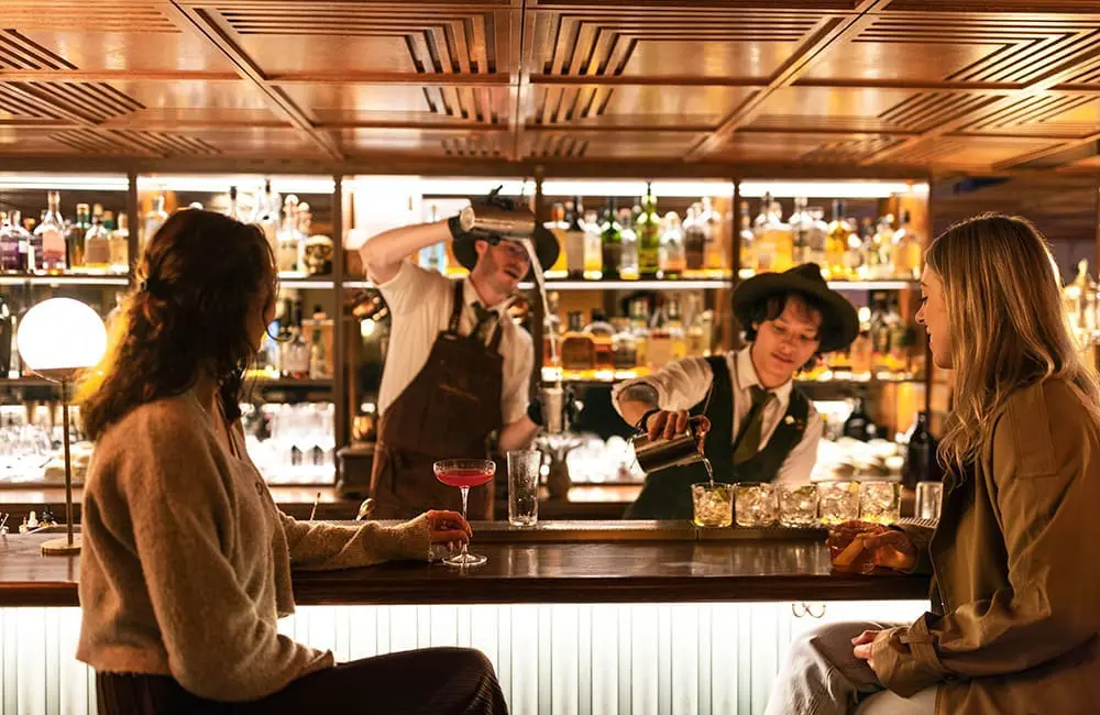 Bartenders at Christchurch's Austin Club. Image: Miles Holden/Tourism New Zealand
