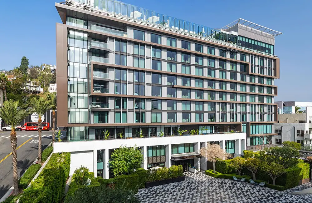 Exterior of The Sun Rose hotel showing the Hollywood Hills. Image: The Sun Rose West Hollywood