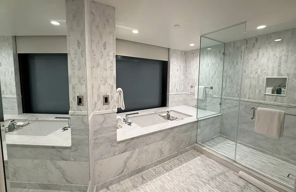 The generously proportioned deep bath and rain shower. Image: Cassie Tannenberg