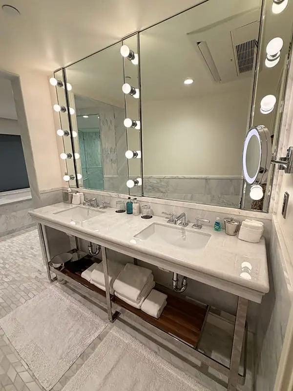 Vanity with mirrors, dual sinks and lights. Image: Cassie Tannenberg