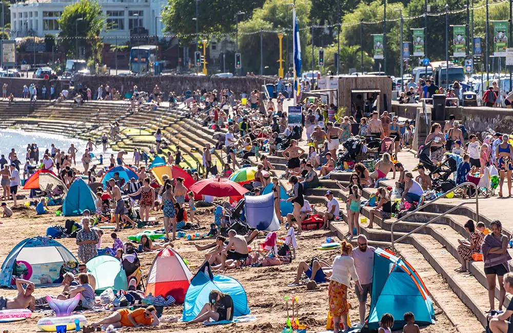 Crowds pack the Torquay seafront during the UK summer heatwave. Image: Thomas Faull/iStock