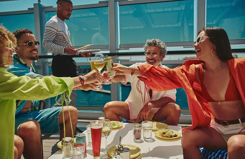 Virgin Voyages Groups program relaunches – friend group on the deck