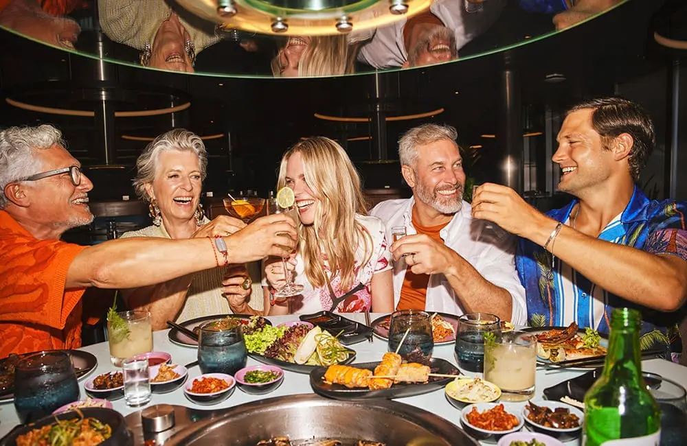 Virgin Voyages Groups program relaunches – group of friends at Gunbae Korean BBQ restaurnat