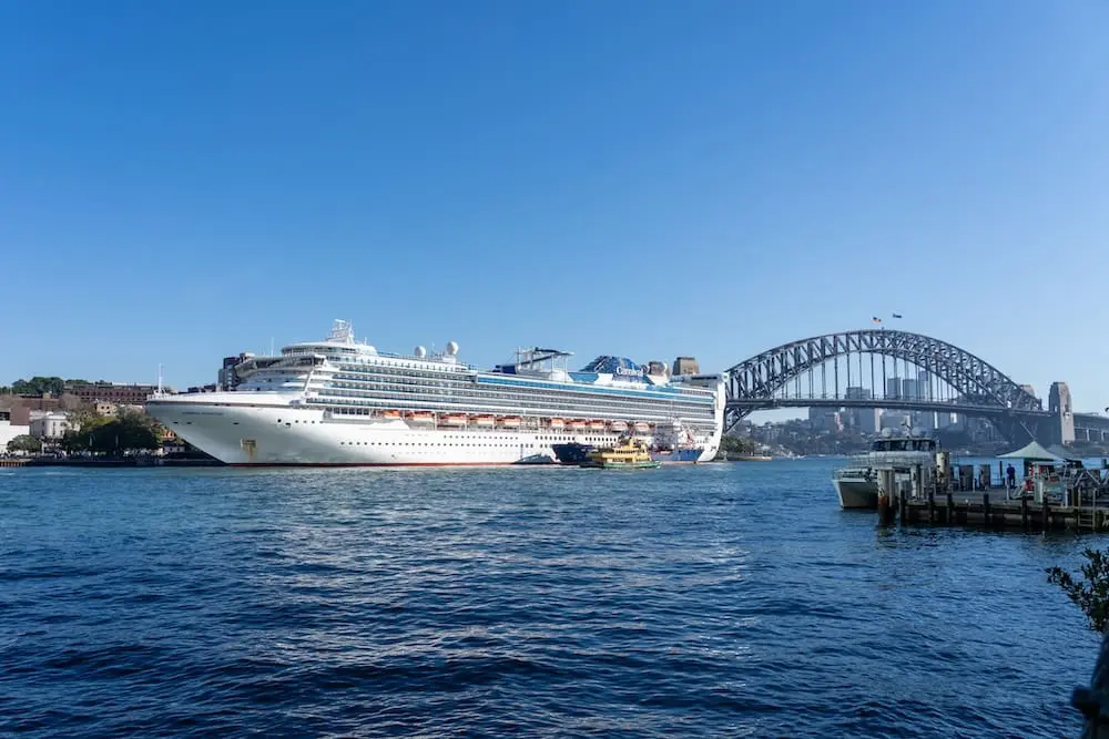 Carnival Corp cyberattack may impact millions of travellers, including Australians 1 Sydney, NSW, Australia - August 13, 2025: A Carnival Adventure cruise ship with Sydney Harbour Bridge in the background. Sydney, NSW, Australia. Carnival Adventure is a cruise ship operated by Carnival Corp