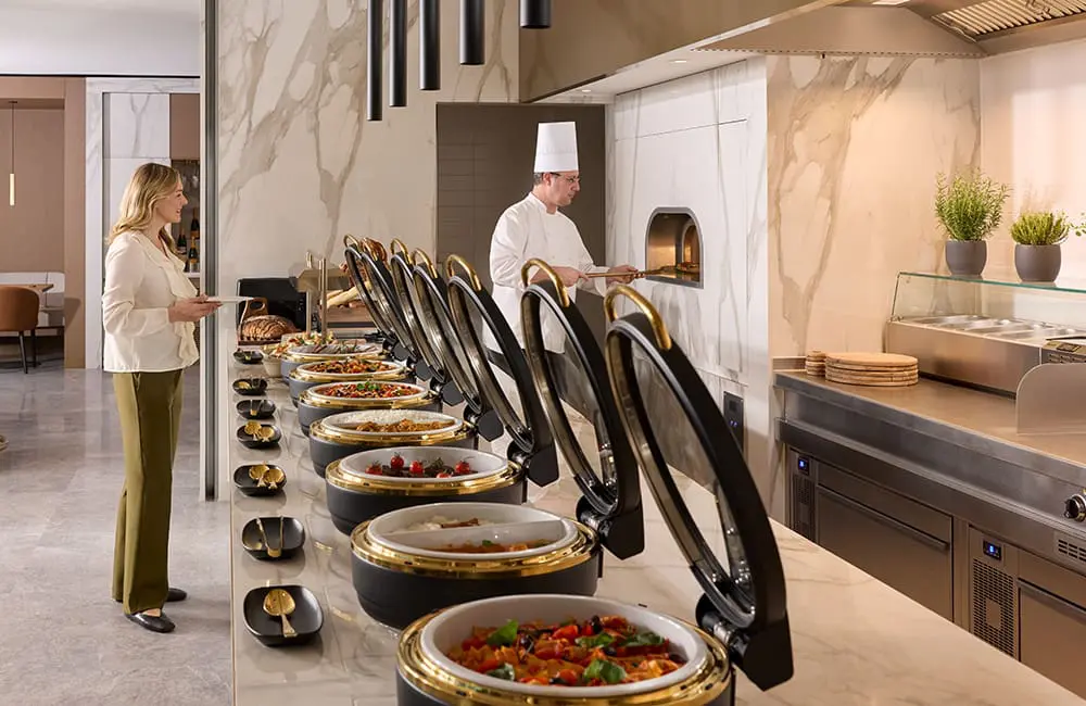 Emirates unveils next-gen lounge concept with Aussie cities on the global network rollout 2 Culinary buffet at the new Emirates Munich lounge. Image: Toby Mitchell