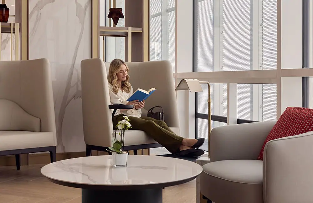 Emirates unveils next-gen lounge concept with Aussie cities on the global network rollout 3 Quiet Zone for work or rest with passenger reading at the Emirates Lounge in Munich. Image: Toby Mitchell