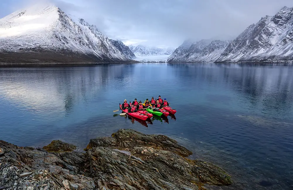 HX and University of Tasmania launch free Svalbard educational course for Aussie travellers 1 Kayakers on an HX expedition trip in Mollerhamna, Svalbard. Image: Jan Hvizdal – HX x UTAS Svalbard Course