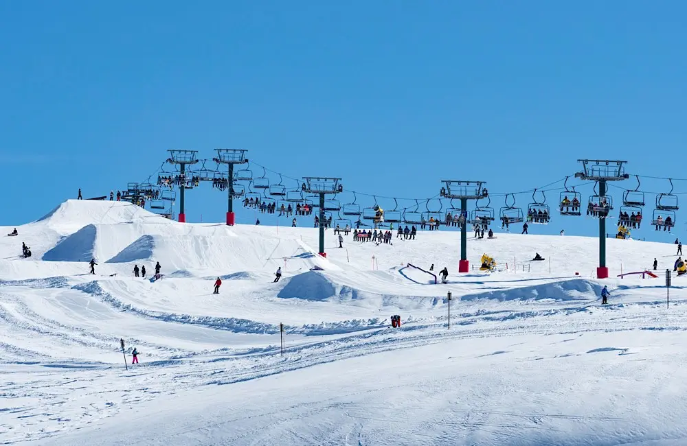 Skiers and snowboarders on the slopes at Mt Hotham.
