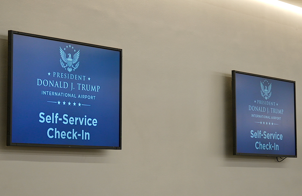 Trump A monitor at a check in counter displays the airport's new name. 