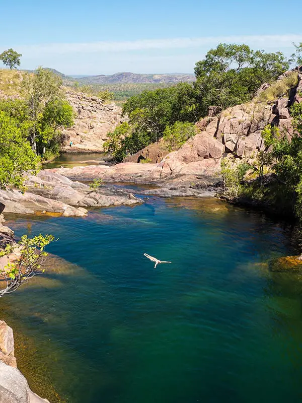 Swimming in Gunlom Falls waterhole in Kakadu National Park. Image: Tourism NT/Jewels Lynch