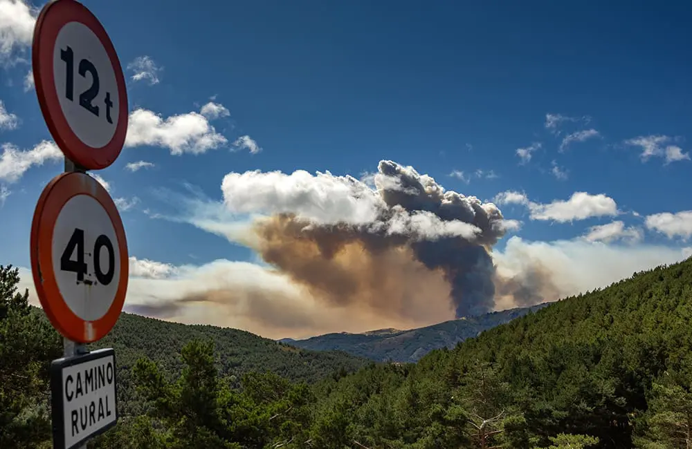 Europe wildfires cause havoc in France & Spain: What travellers need to know 2 Smoke rises above Sierra Norte de Guadalajara Natural Park in Spain due to Europe wildfires. Image: Jose Gonzalez/iStock