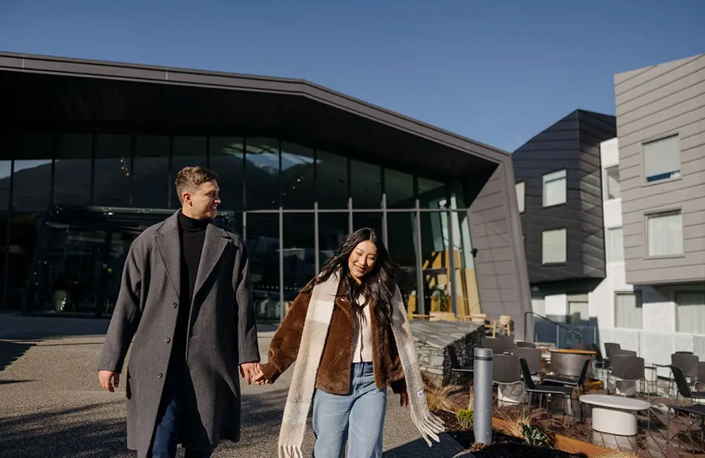 Couple outside voco Queenstown hotel. Image: IHG Hotels & Resorts