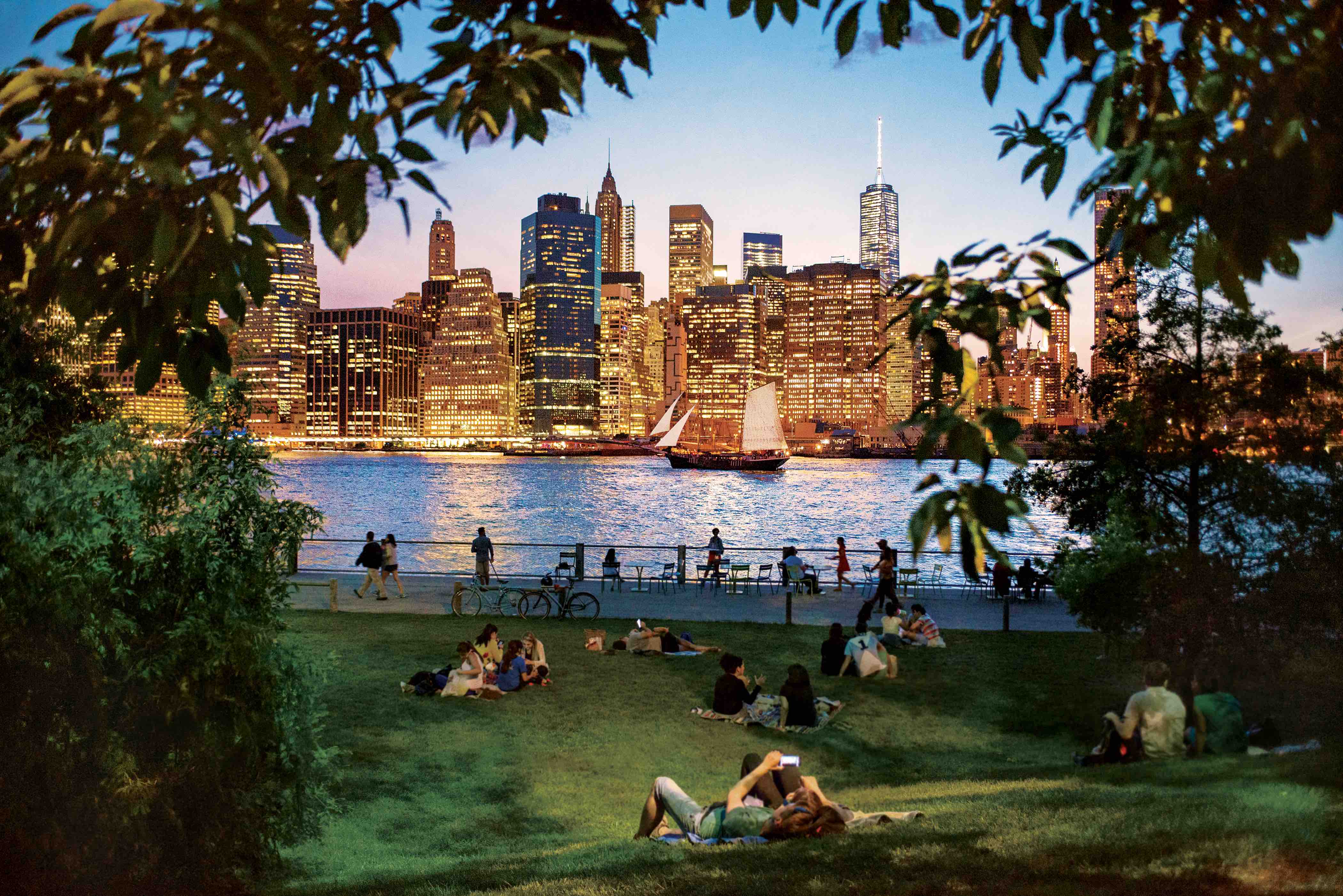 The Daily Travel Agent Bite: Tues 5 Jul 22 Brooklyn Bridge Park; Brooklyn; high vantage point; vantage point; bridges; bridge; skyline; activity; lower manhattan; dusk; twilight; pink sk