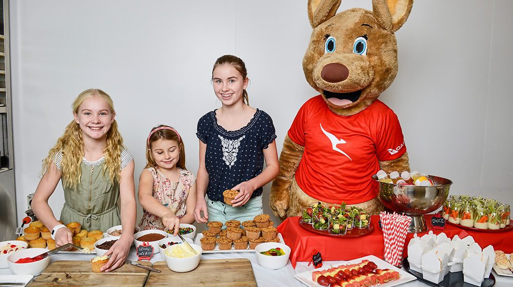KIDS QUISINE: Qantas surprises young flyers with POP-UP food stations