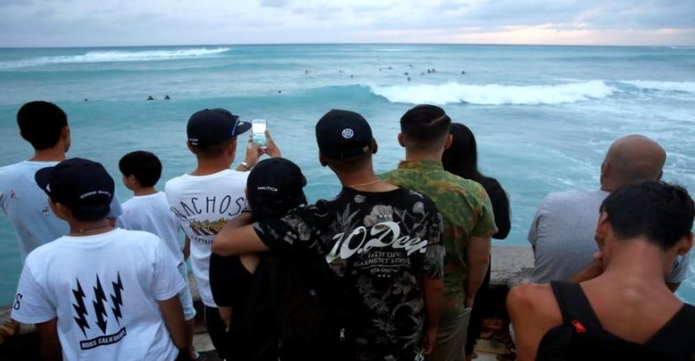 SURF'S UP: Daredevils ride the big swell during Hawaii's hurricane