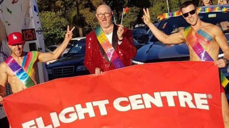 TRAVEL PRIDE: Flight Centre Agents wave the rainbow flag in Adelaide