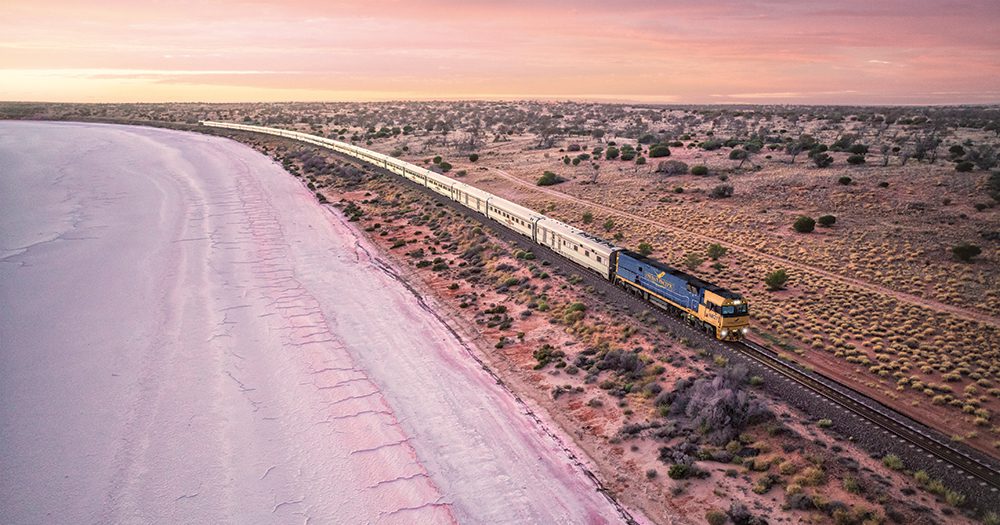 The Indian Pacific passing Lake Hart, a dry salt pan north of Woomera in South Australia