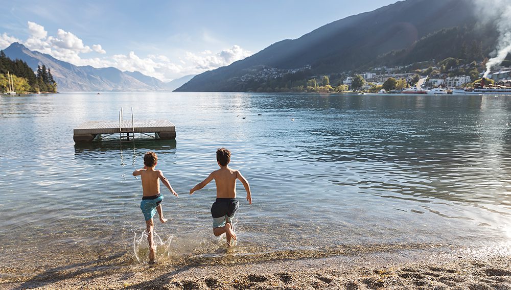 Children swimming at Lake Wakatipu. Image credit: Destination Queenstown