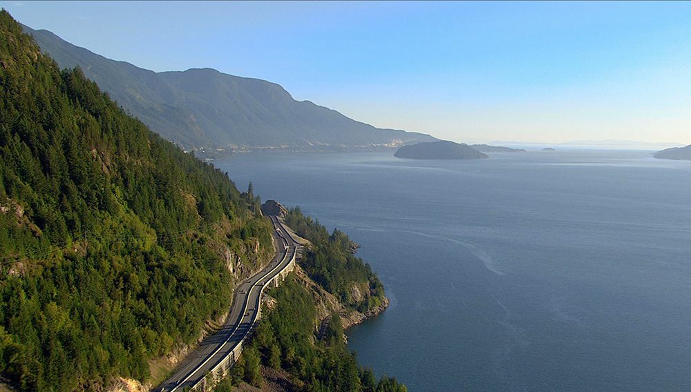 Driving the scenic Sea to Sky Highway between Vancouver and Whistler. Image credit: Destination British Columbia