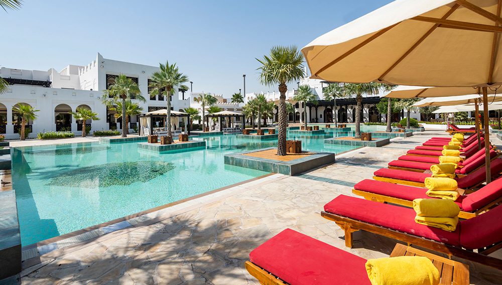 Relax by the pool at Sharq Village & Spa. Set along Qatar's golden coastline, this secluded paradise offers a private beach, luxury villas and award-winning dining.