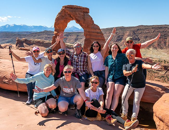 Group-at-Delicate-Arch-in-Arches-National-Park-(Moab,-Utah)