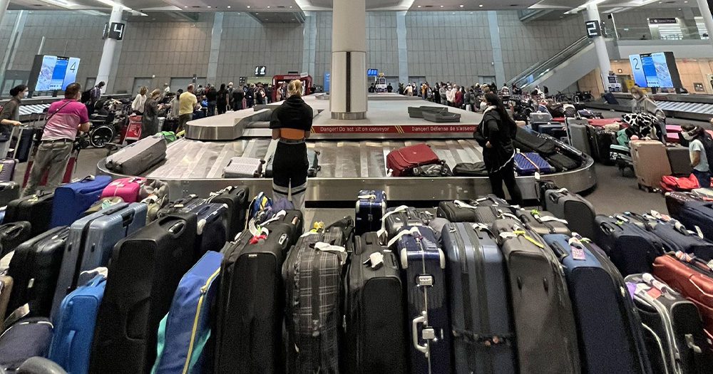 Luggage piles join long airport lines in fresh woes for Northern hemisphere travel