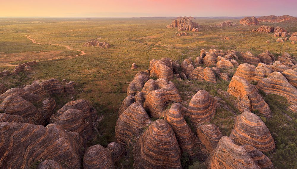 View the dazzling Bungle Bungle Range on a scenic flight, camp under the stars and explore hidden gorges at Purnululu National Park ©Tourism Western Australia