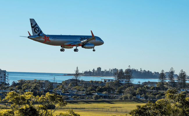 A Jetstar plane landing at Gold Coast Airport.