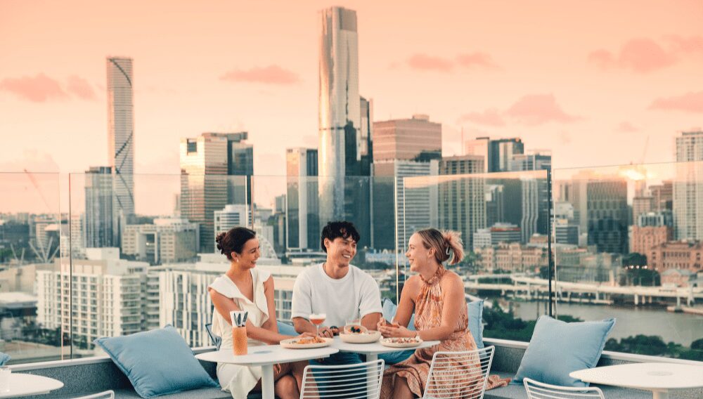 Friends enjoying a drink at Lina Rooftop ©Tourism and Events Queensland