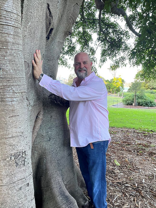 A tree hugging Greg Close