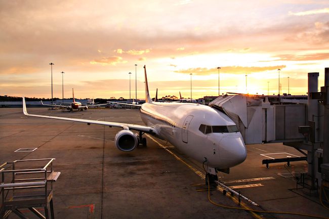 Plane at Melbourne Airport Terminal at Sunrise