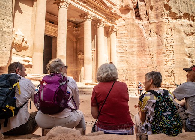 Tour group sitting by the Treasury Petra