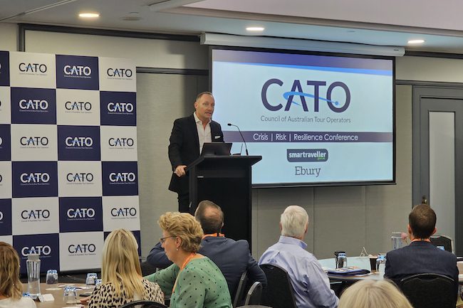FCTG, DFAT, travel law & insurance experts talk risk, resilience at CATO conf. 2 MC Mark Carter at CATo