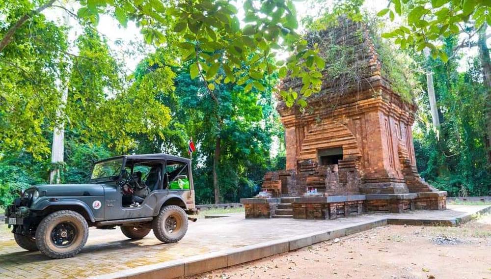 jeep in front of temple in hoi an for a Compass Expeditions tour in Vietnam